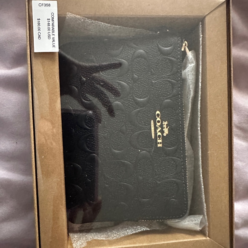 Coach small black wristlet with charms